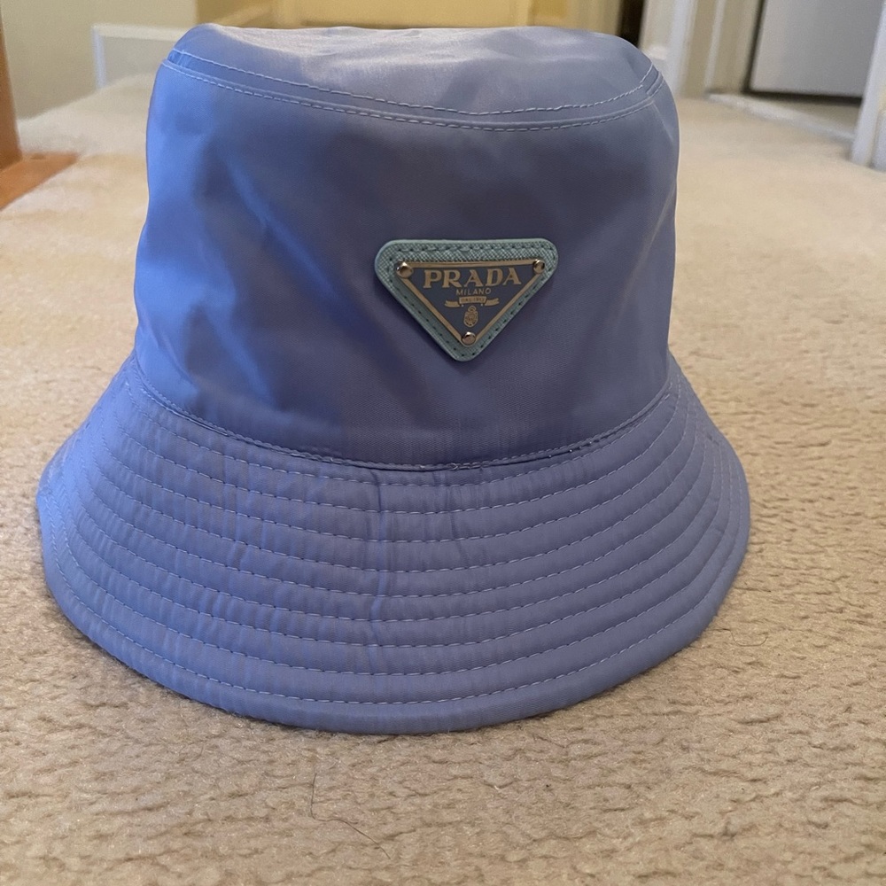 Blue Prada bucket hat. Minor damage in the inside of the hat.